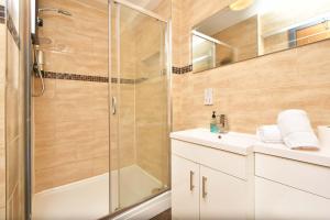 a bathroom with a shower and a sink at Smithfield Apartments - Gated Executive City Centre Apartments in Stoke on Trent