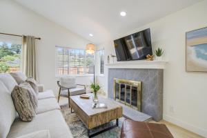 a living room with a couch and a fireplace at 3892 Carmel Pearl home in Carmel