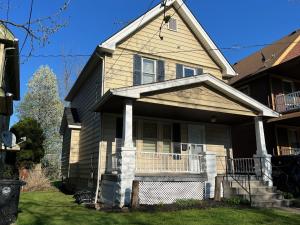 a house with a porch and a balcony at Trendy in Tremont, Cleveland (Upper) in Cleveland