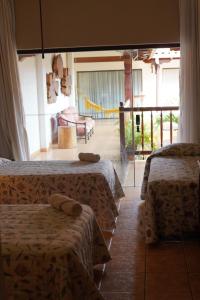 Un pat sau paturi într-o cameră la Hotel La Mision