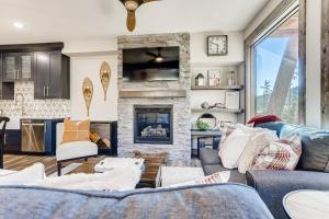 a living room with a couch and a fireplace at Seasons 1825 in Keystone