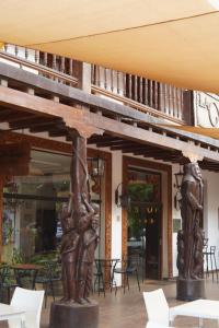 a statue in the lobby of a restaurant at Hotel La Mision in San Ignacio de Velasco