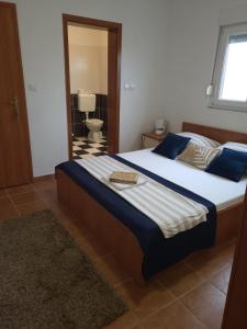 Ein Bett oder Betten in einem Zimmer der Unterkunft Apartments Bralic