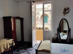 Postel nebo postele na pokoji v ubytování Triomphe Hostel