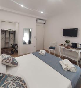 מיטה או מיטות בחדר ב-Dimora Alba sul Mare