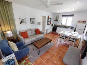 a living room with a couch and a table at Immaculate Casa 2 bed 2 bath with pool Casa Oriana Oria Almeria in Oria