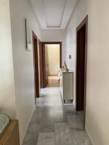 a corridor of a room with a hallwayngthngthngthngthngthngthngthngth at cozy appartement with swimming pool in Agadir