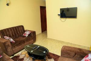 TV a/nebo společenská místnost v ubytování Palm Star Motel