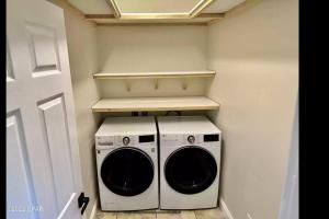 a washer and dryer in a small room at Vacation home next to the beach! in Panama City Beach