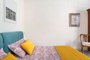 A bed or beds in a room at Casa Calderai art and design