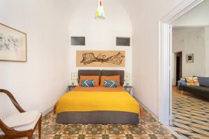 A bed or beds in a room at Casa Calderai art and design
