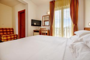 Postel nebo postele na pokoji v ubytování Hotel Posejdon