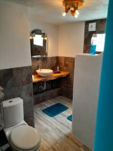 a bathroom with a white toilet and a sink at Casa Lantana in Figueira da Foz +141 photos