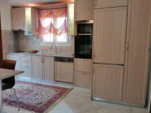 A kitchen or kitchenette at Prime Luxury Villa beach front