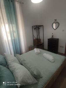 a bed with two pillows on it in a bedroom at Casa do Trovão - Douro in Peso da Régua +35 photos