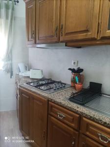 a kitchen with a stove and a counter top at Casa do Trovão - Douro in Peso da Régua