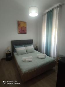 a bedroom with a bed with two pillows on it at Casa do Trovão - Douro in Peso da Régua