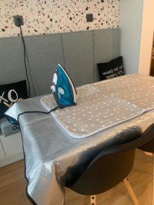 a bed with a fish pillow on top of it at LUXURIOUS ONE BEDROOM STUDIO IN TOP CENTER in Blagoevgrad