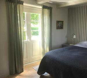 Postel nebo postele na pokoji v ubytování Staevnegaarden