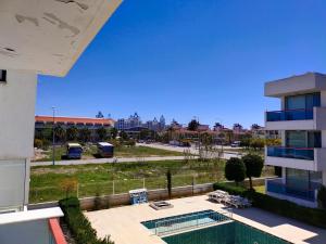 a view of a parking lot from a building at Cozy and Peaceful Apartment In the Belek Center in Belek