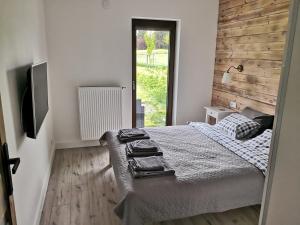 Posteľ alebo postele v izbe v ubytovaní Apartament Na Kamieniaku