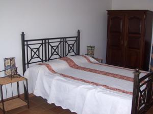 A bed or beds in a room at Casa típica no campo