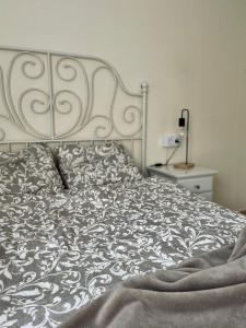Posteľ alebo postele v izbe v ubytovaní P.S. Apartment