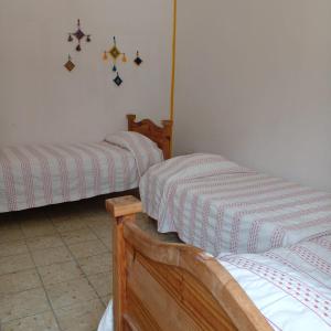 Postel nebo postele na pokoji v ubytování Vive Alegria Hostel