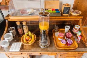a counter with a blender and a tray of food at Le Relais Des Templiers in Beaugency
