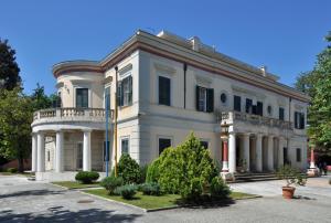a large white building with a balcony at Villa Armeni by CorfuEscapes in Corfu