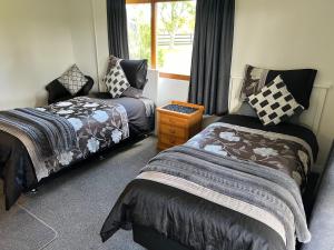 Llit o llits en una habitació de A Cut Above - The Gateway to the Bay of Islands