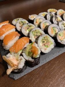 a bunch of sushi on a plate on a table at Agroturystyka Kobylnica nad Wisłą in Kobylnica