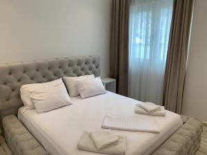 Postel nebo postele na pokoji v ubytování Delfin Apartments
