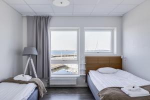 Postel nebo postele na pokoji v ubytování Hotell Hamnen