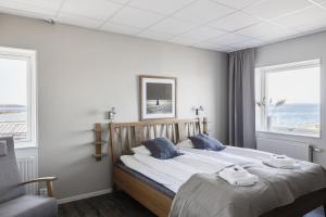 Postel nebo postele na pokoji v ubytování Hotell Hamnen