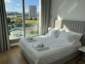 Katil atau katil-katil dalam bilik di The Address-Seafront Luxury 2 Bedroom Residence +30 gambar