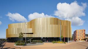 a large building with a yellow facade at Modern and spacious Swansea centre apartment in Swansea