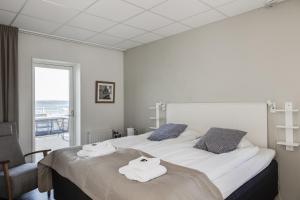 Postel nebo postele na pokoji v ubytování Hotell Hamnen