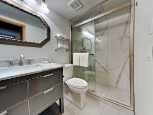 a bathroom with a shower and a toilet and a sink at Timberline Condominiums 1 Bedroom plus Loft Deluxe Unit B3C in Snowmass Village +17 photos