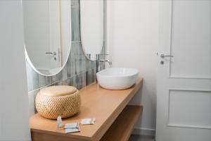 a bathroom with a sink and a mirror at Zabbara in Noto