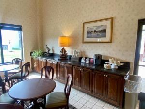 a dining room with a table and a table and chairs at Onley Inn in Onley