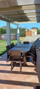 a table and chairs sitting under a pavilion at Casa do Tonel in Sagres