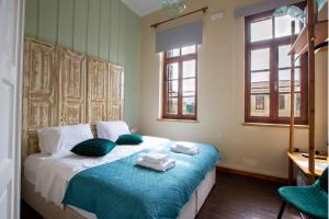 Letto o letti in una camera di Ruby 'n Emerald studio's