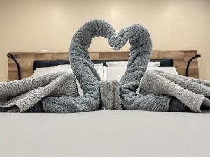 Postel nebo postele na pokoji v ubytování LoveRoom - Au Loge Love