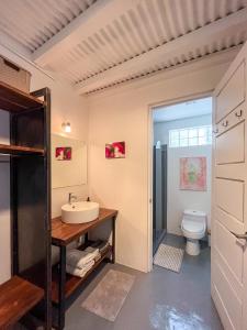 a bathroom with a sink and a toilet at Salt Nosara in Nosara +204 photos