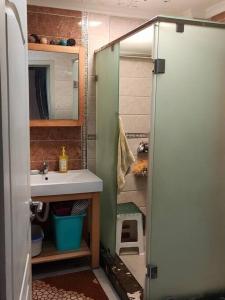 a small bathroom with a sink and a shower at Appartement Meublé Quartier Hassan Rabat in Rabat