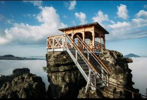 a small building on top of a rock formation at Podkrovní apartman Tereza in Rumburk