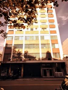 a tall building with balconies on the side of it at Departamento Del Plaza in Bahía Blanca