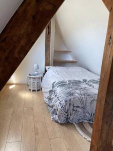 a bedroom with a bed in a attic at Loft 60 m2, Le Vieux-Mans in Le Mans