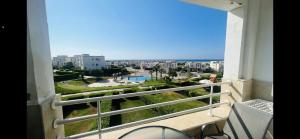 a balcony with a view of a city at Amwaj amazing see view in Marsa Matruh